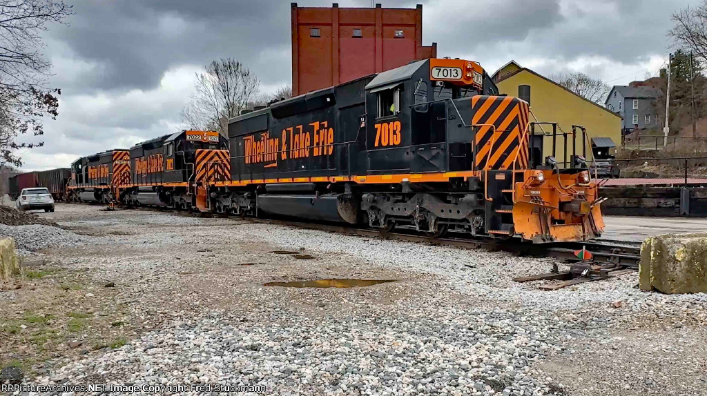 WE 7013 now shoves the empties into Rock Cut Siding.
